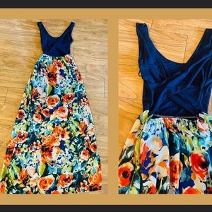 LeLis Floral, bloom-covered maxi dress, vibrant colors, open criss-cross back.